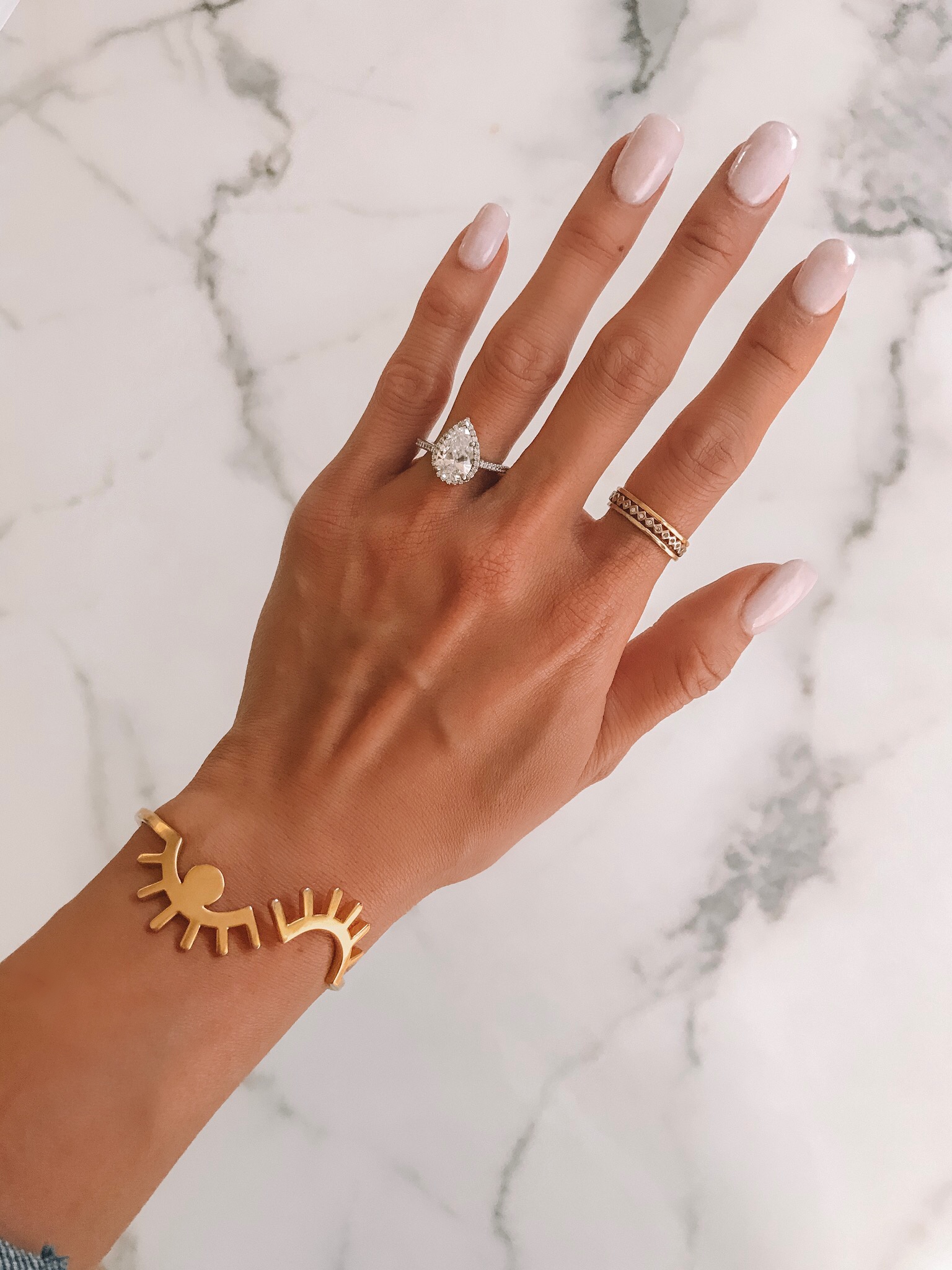pear shaped halo diamond engagement ring